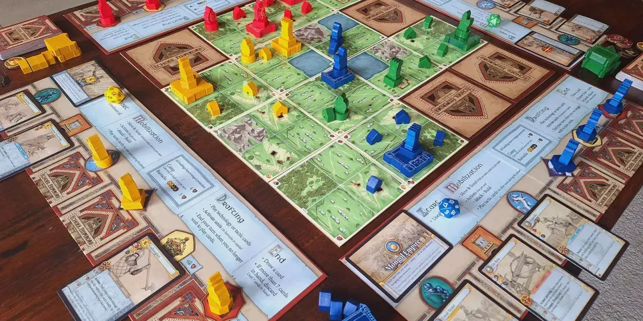 Un tavolo con un gioco da tavolo di strategia, con pedine rosse, gialle, blu e verdi. Un esempio di giochi 4x.