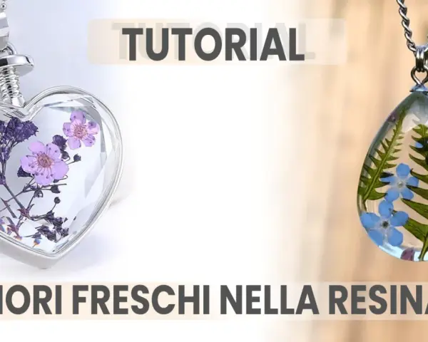 Ciondoli a forma di cuore e goccia con fiori freschi nella resina, perfetti per un tutorial creativo.