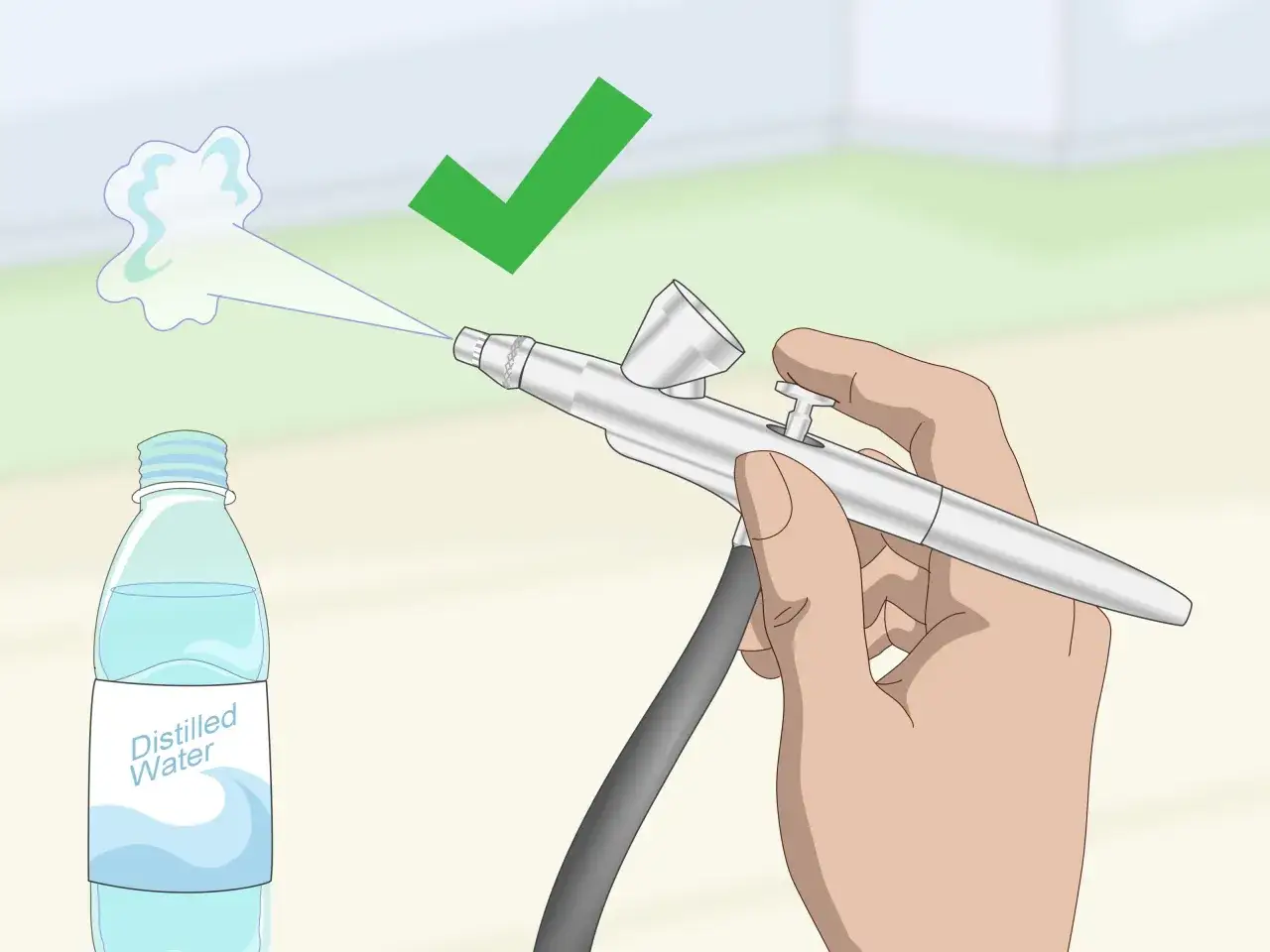 Mano che tiene un aerografo, spruzzando acqua distillata. Un segno di spunta verde indica che il processo di pulire aerografo &egrave; completato con successo.