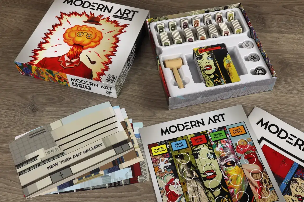 Il gioco da tavolo Modern Art, con la sua scatola esplosiva e le carte d'arte pop, pronto per una sfida tra collezionisti.